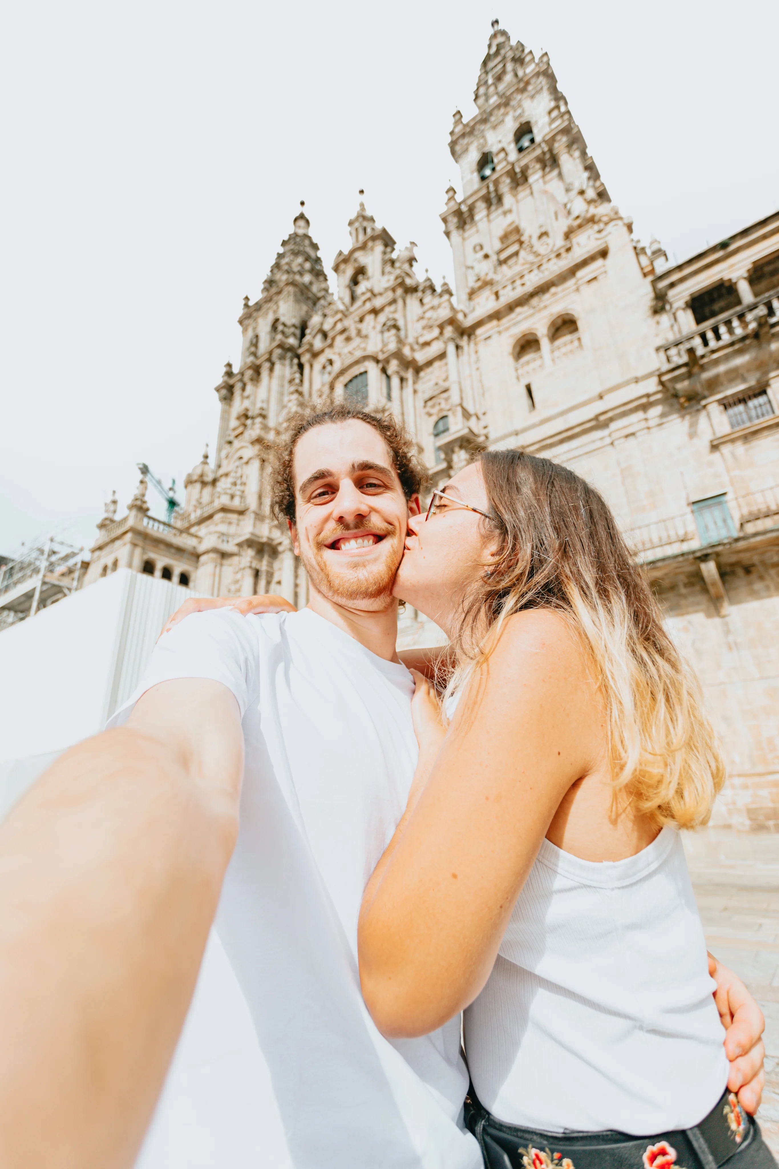files/man-takes-selfie-while-a-woman-kisses-him.webp